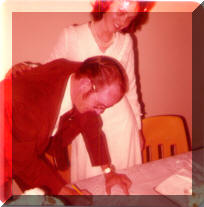 George signing marriage license.